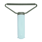 Pet grooming brush with soft silicone bristles and ergonomic handle for gentle deshedding