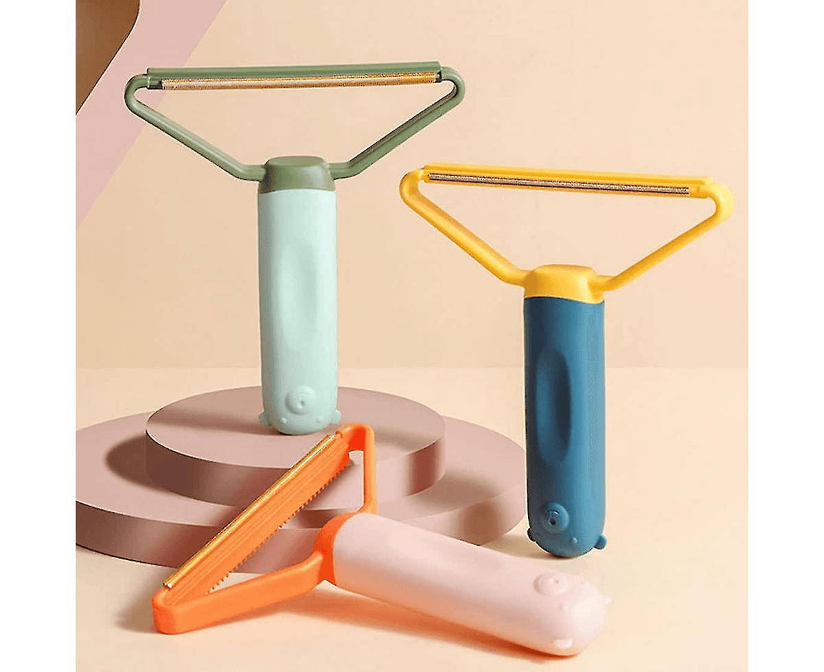 Colorful pet grooming brushes with ergonomic handles for dog and cat fur removal